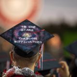 mortar board cap reading "to the stars through difficulties"