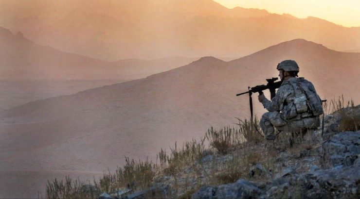 U.S. Army Spc. Jason Hebert provides security in the early dawn during an air assault mission above in Zabul province, Afghanistan, 2009. (U.S. Army photo by Spc. Tia P. Sokimson)
