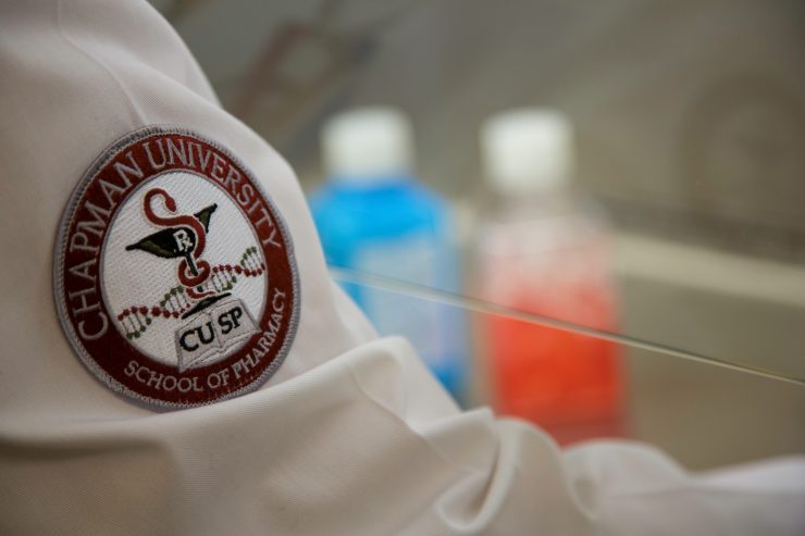 close up photo of pharmacy student's white coat with chapman logo