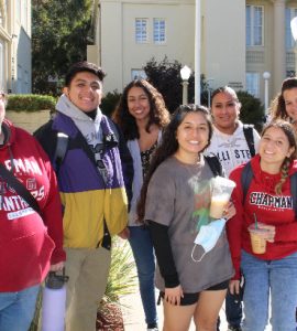 Seven of the 13 Chapman students in the inaugural C-TAG for Future Educators cohort. Angalina Maldonado (back far right), Aidee Guerrero (back right, second from the end), and Olivia Fonseca (front center).