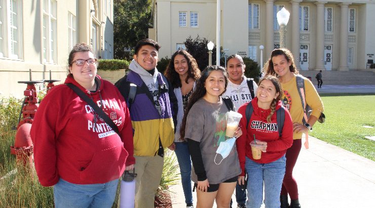 Seven of the 13 Chapman students in the inaugural C-TAG for Future Educators cohort. Angalina Maldonado (back far right), Aidee Guerrero (back right, second from the end), and Olivia Fonseca (front center).