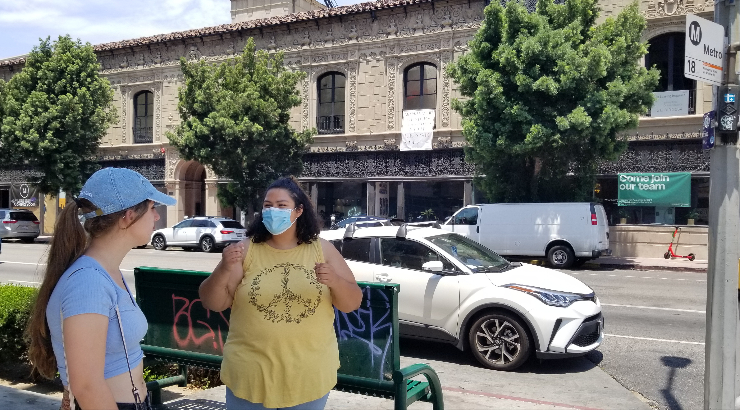 Hazel Thurston and Isabelle Garcia outside the Chapman Market.
