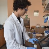 male student in research lab