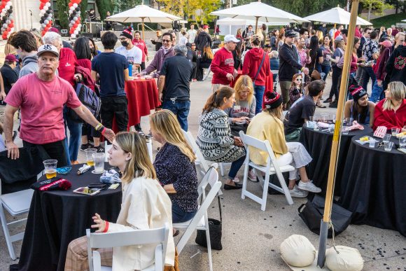 homecoming crowd at tables in attalla piazza