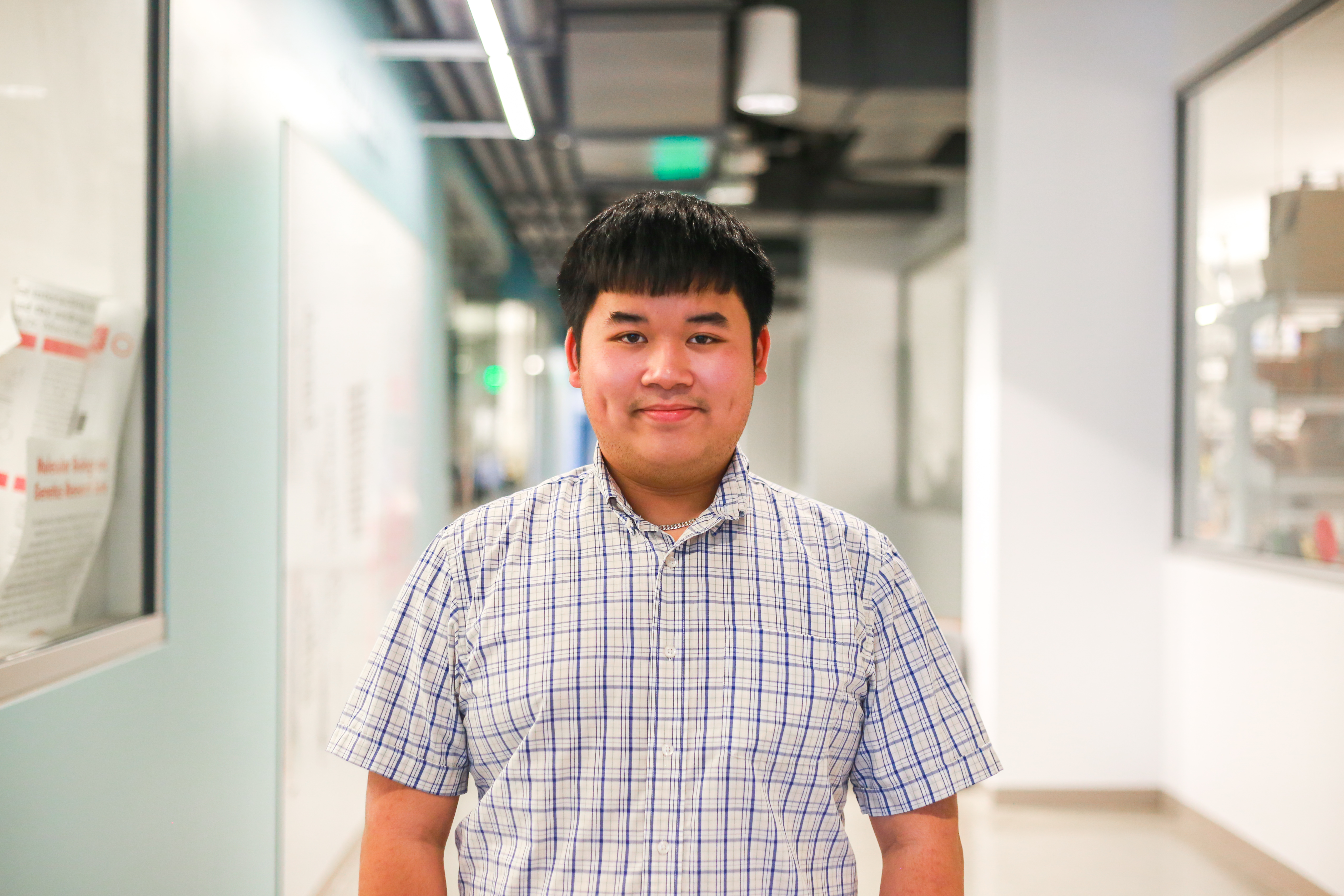 Kevin Nguyen poses in the Keck Center hallway.