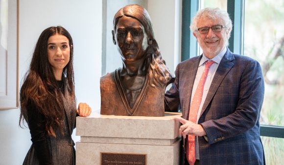 nadia murad and daniele struppa flanking bust of murad