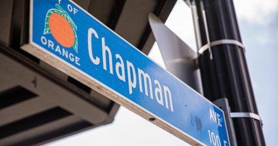 blue street sign from the City Orange with the street name Chapman Ave