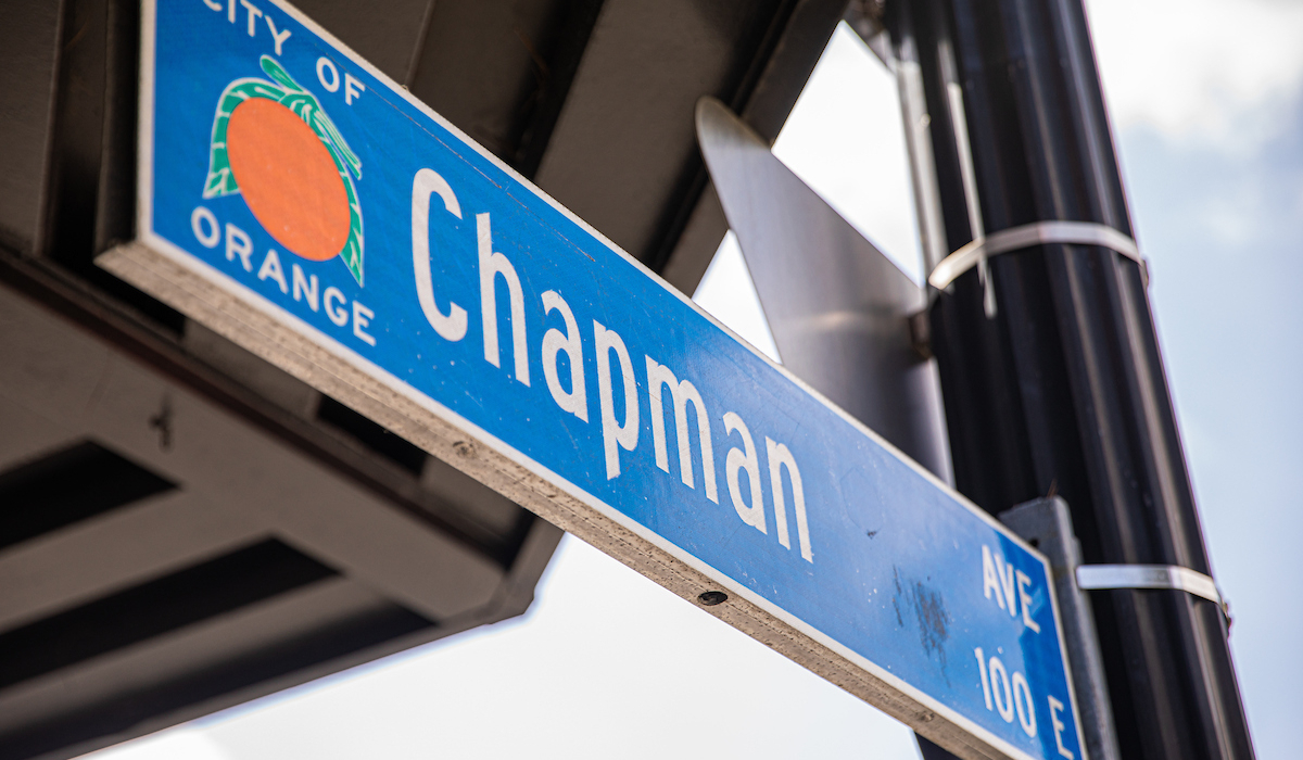 blue street sign from the City Orange with the street name Chapman Ave