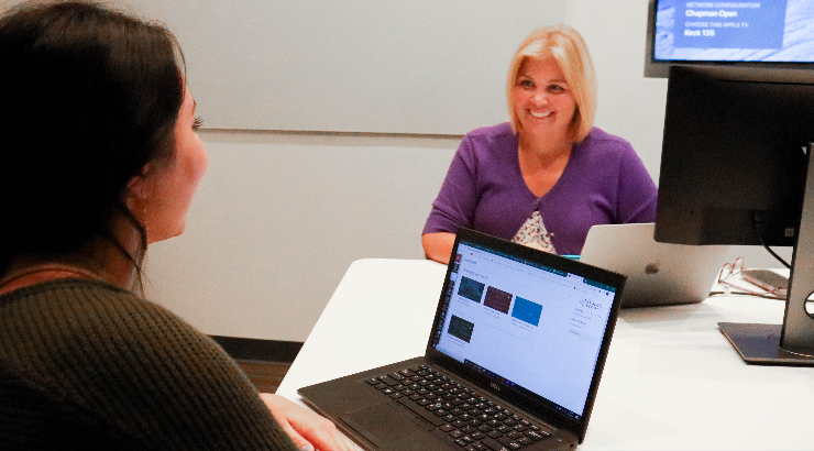 Christine Crispen counsels a student.