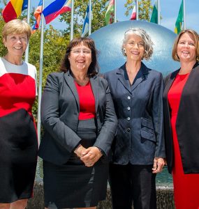 Helen Norris, Janine DuMontelle, College Creppell, Jamie Ceman pose in front of Chapmans global citizens plaza fountain