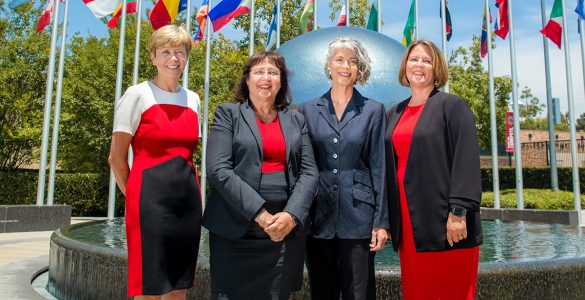 Helen Norris, Janine DuMontelle, College Creppell, Jamie Ceman pose in front of Chapmans global citizens plaza fountain