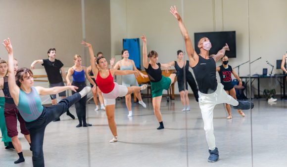 dancers in ballet pose in studio