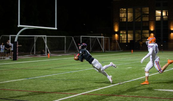 chapman football player dives for catch near end zone