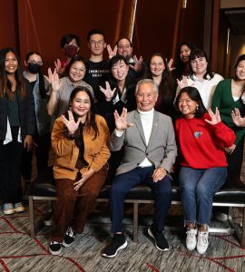 Actor, activist and author George Takei poses with students.