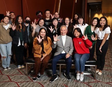 Actor, activist and author George Takei poses with students.