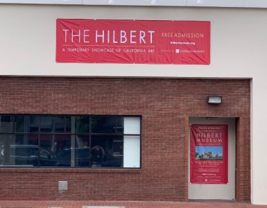 storefront in old towne Orange with The Hilbert temporary signage