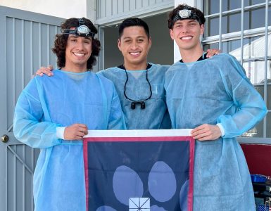 randy rosales with two pre-dental students in scrubs