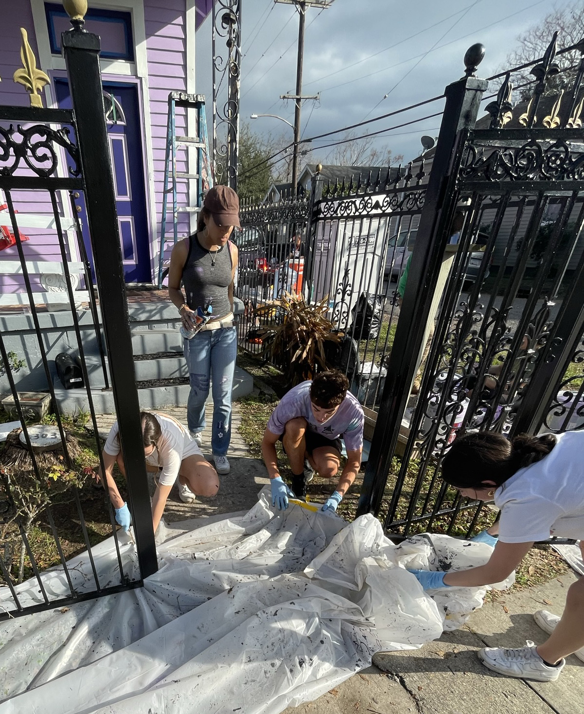 students work on a gate in new orleans