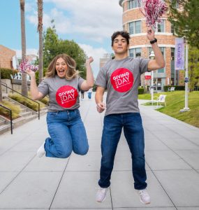 Rachel Berns ’24 and Jacob Zamore ’26 wearing Chapman t-shirts on campus walkway