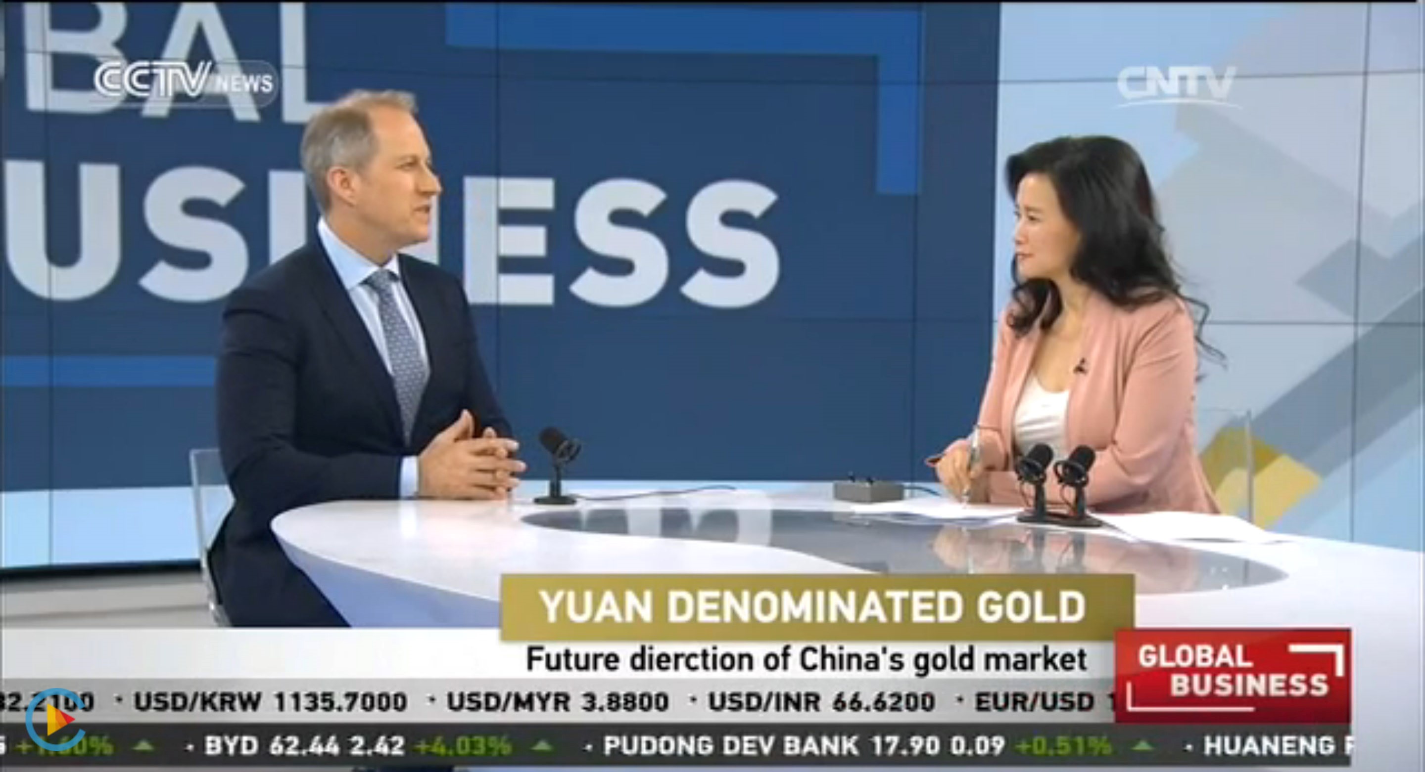 Asia-Pacific Geoeconomics and Business Initiative Director Robert Koepp, left, appears on television.