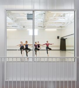 window view of dancers in studio