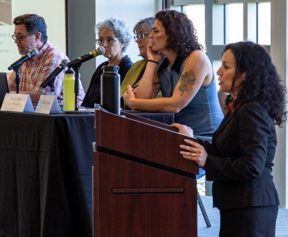 Fowler School of Law interim Dean Marisa Cianciarulo speaks at the school's climate conference April 21. Panelists included law Professor John Hall, left.