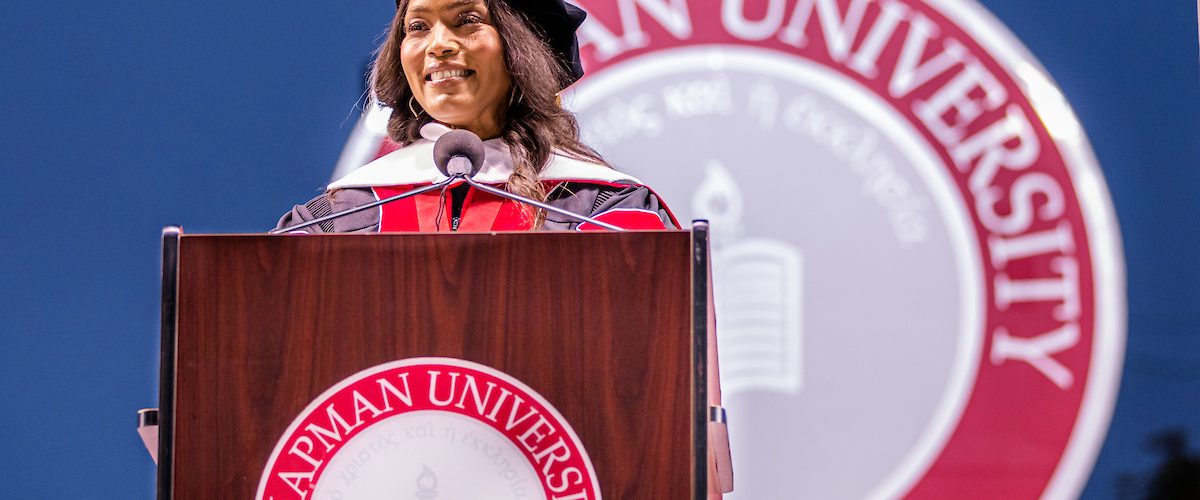 angela basset at podium with the chapman university seal behind her