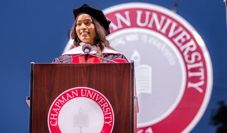 angela basset at podium with the chapman university seal behind her