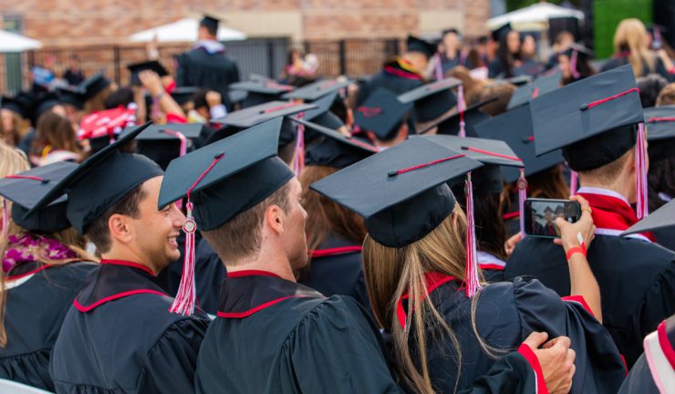 rear few of students in caps and gowns