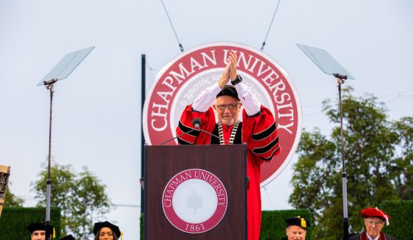 daniele struppa at podium, wearing red and black academic regalia