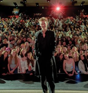 Austin Butler standing in front of audience at Folino Theatre