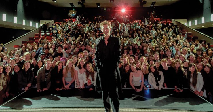 Austin Butler standing in front of audience at Folino Theatre