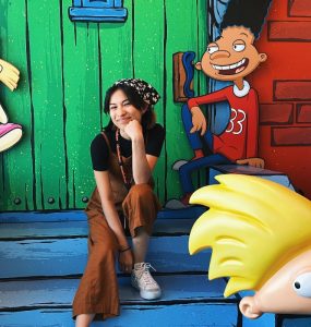 hailey silva on cartoon steps with characters from Hey Arnold