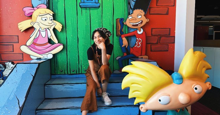 hailey silva on cartoon steps with characters from Hey Arnold