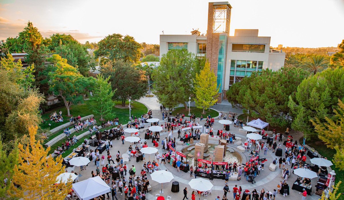 arial view of attallah piazza with tables, booths and people