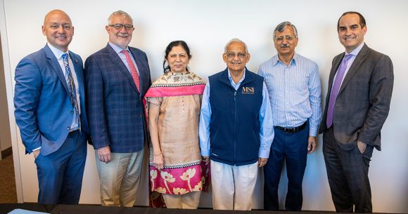 Chapman leadership with the Shah family during the gift agreement signing