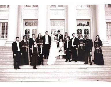 black and white photo wedding party on memorial hall steps