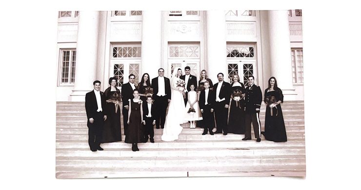 black and white photo wedding party on memorial hall steps