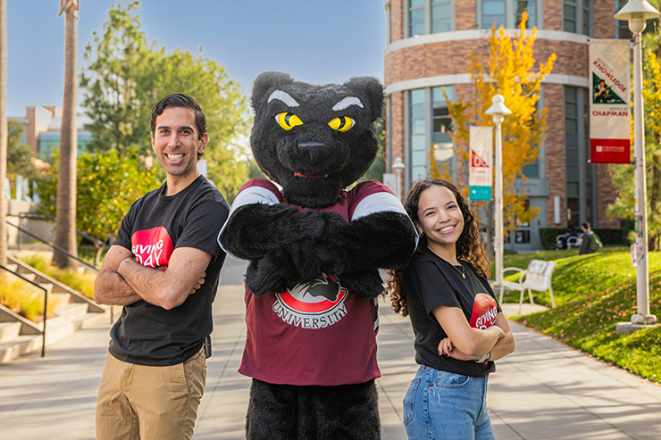 Pete the Panther and two students