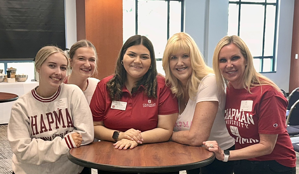 group of women in red and white chapman shirts
