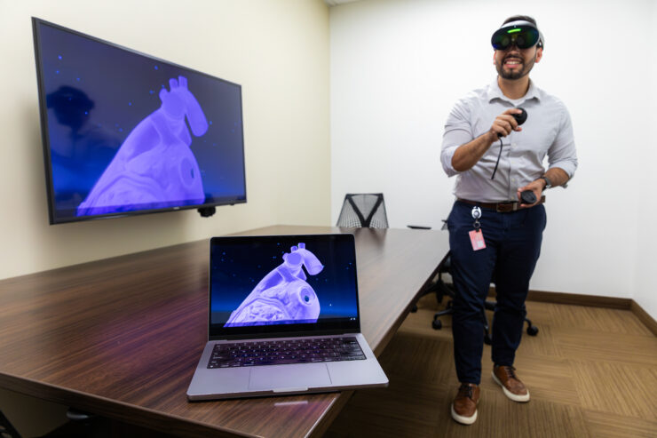 Rinker Health Science Campus library services director Ivan Portillo demonstrates the library's VR technology.