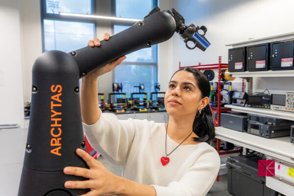 student with robotic arm