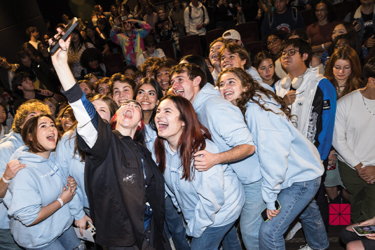 billie eilish taking selfie with students