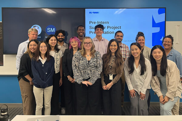 group of people in front of presentation screen