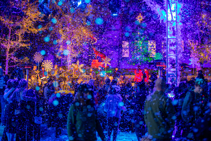 attallah piazza filled with falling snow and lights