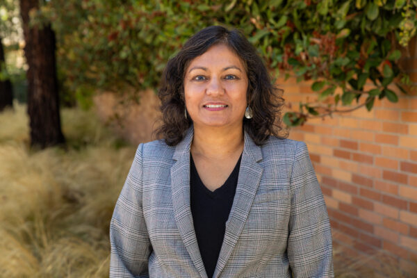 Associate Professor Dr. Charu Sinha, newly appointed Academic Director of Chapman University's Master of Science in Business Analytics program, stands on campus following the program’s official announcement.