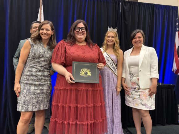 Community Relations accepts Best of Orange Award
