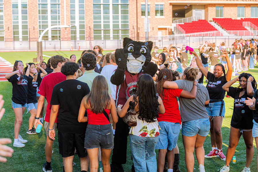 pete the panther surrounded by students