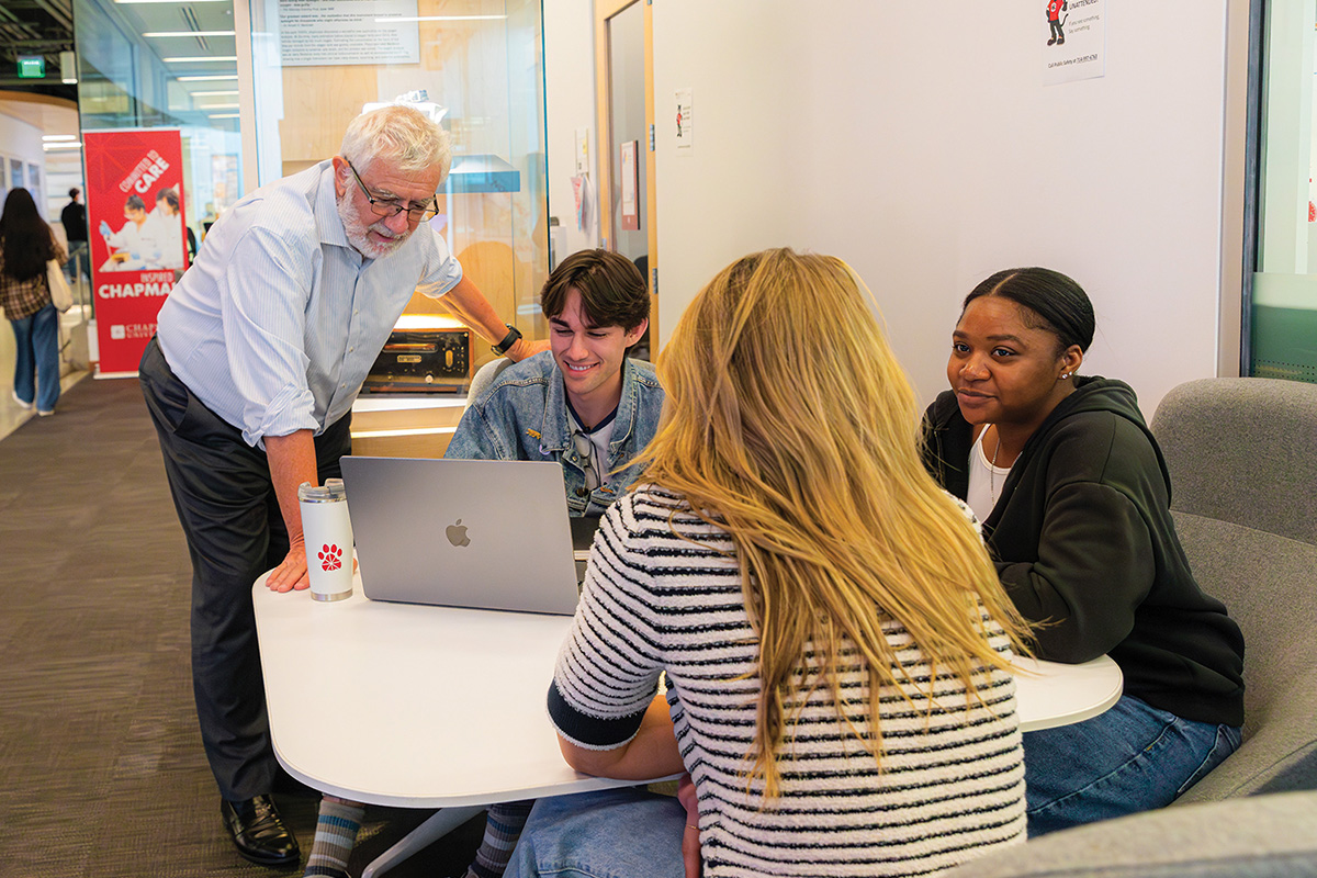 President Daniele Struppa conversing with Chapman University students