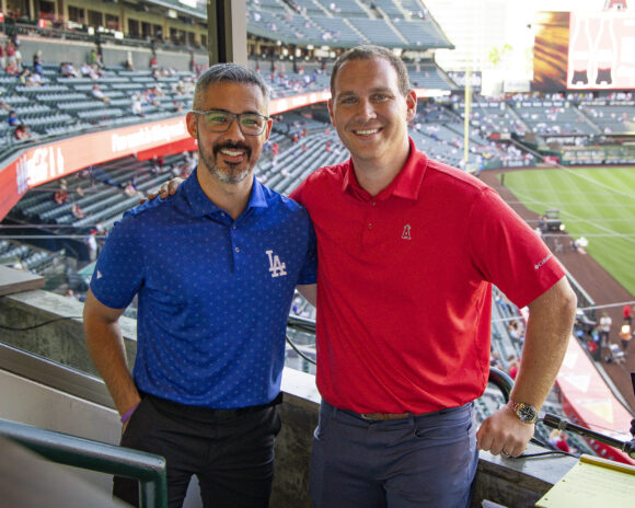 Stephen Nelson (left) and Trent Rush (right) reconnect before their respective teams face off at Angels Stadium.